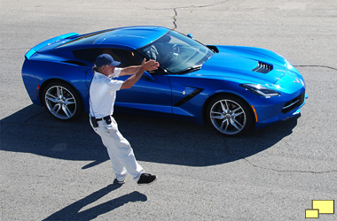 2016 Chevrolet Corvette w/Z51 in Laguna Blue Tintcoat At Willow Springs International Raceway with a course worker